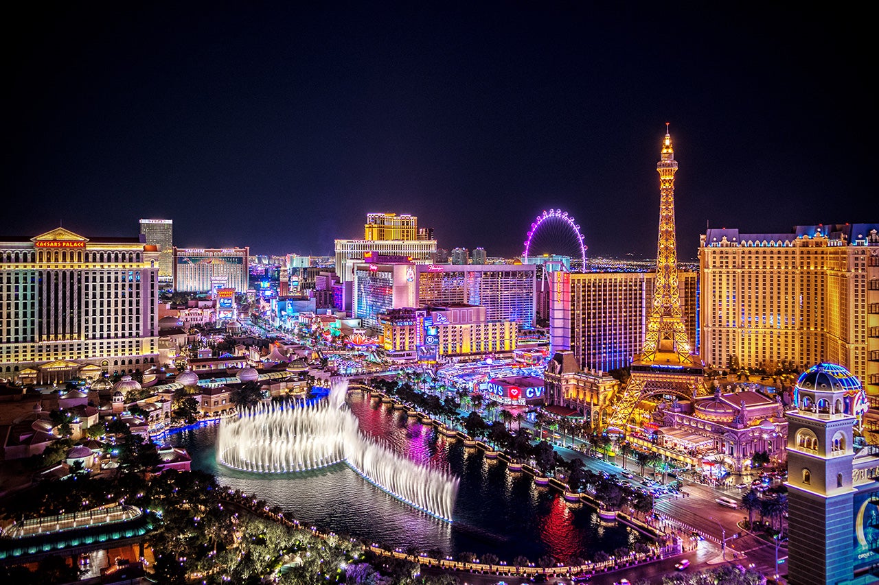 An aerial photo shows the Las Vegas strip at night, featuring the Bellagio Fountain, casinos and hotels. (Getty Images)