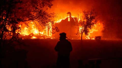 TOPSHOT - A home burns in Vacaville, California during the LNU Lightning Complex fire on August 19, 2020. - As of the late hours of August 18,2020 the Hennessey fire has merged with at least 7 fires and is now called the LNU Lightning Complex fires. Dozens of fires are burning out of control throughout Northern California as fire resources are spread thin. (Photo by JOSH EDELSON / AFP) (Photo by JOSH EDELSON/AFP via Getty Images)