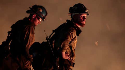 Blue Ridge Hot Shots crew members from Arizona join forces with California firefighters from Northern and Southern California on a backfire operation North of Mt. Wilson on Angeles Crest Highway. Firefighters continue to battle the Bobcat Fire as it continues to burn on Tuesday, Sept. 22, 2020. (Robert Gauthier/ Los Angeles Times via Getty Images)