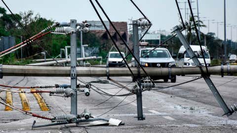 View of fallen power lines after the passage of Hurricane Zeta, in Puerto Morelos, Quintana Roo state, Mexico, on Oct. 27, 2020. Zeta was downgraded to a tropical storm on Tuesday after making a landfall on Monday night as a Category 1 hurricane near the resort of Tulum, in the Mexican Caribbean, hit recently by cyclone Delta. (Elizabeth Ruiz/AFP via Getty Images)