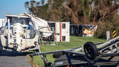 Overturned trailers sit along LA-46 after Hurricane Zeta on Oct. 29, 2020, in Reggio, La. A record seven hurricanes have hit the gulf coast in 2020 bringing prolonged destruction to the area. (Sandy Huffaker/Getty Images)