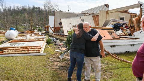 A neighbor hugs Danny Poss, pastor of Ragan Chapel United Methodist Church, as he surveys tornado damage at the church, on March 26, 2021, in Ohatchee, Ala. (Julie Bennett/Getty Images)