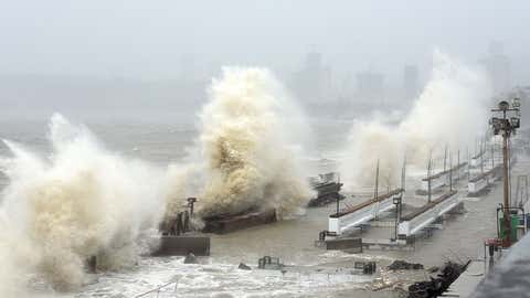 Waves lash a shoreline in Mumbai on May 17, 2021, as Cyclone Tauktae, packing ferocious winds and threatening a destructive storm surge, bears down on India, disrupting the country's response to its devastating COVID-19 outbreak. (Sujit Jaiswal/AFP via Getty Images)
