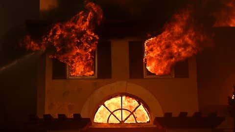 Firefighters battle a brush fire at Coronado Pointe in Laguna Niguel, Calif., Wednesday, May 11, 2022. (Wally Skalij/Los Angeles Times via Getty Images)