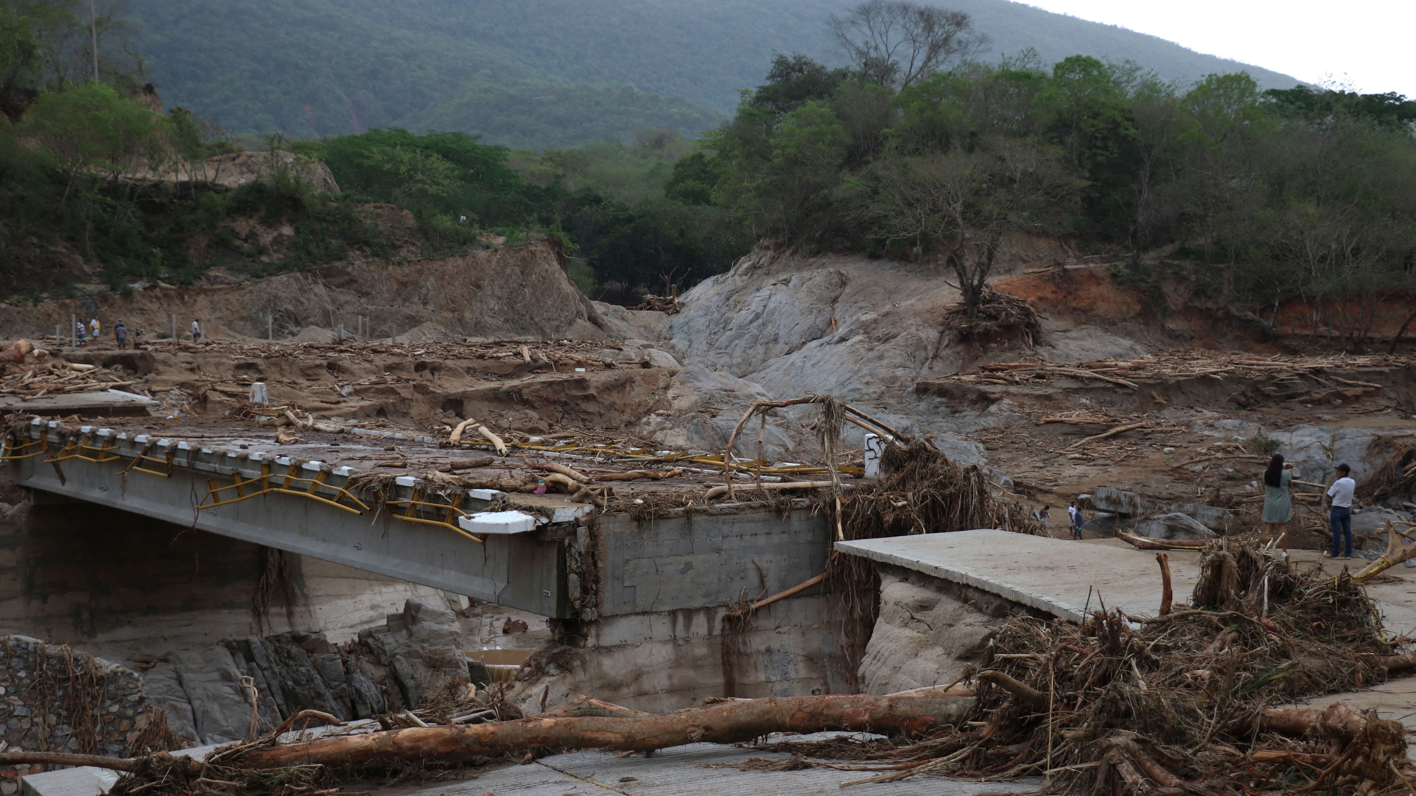 The heavily damaged Puente Herradura (Herradura Bridge) is photographed above after Hurricane Agatha struck in Huatulco, Oaxaca state, Mexico, on June 1, 2022. At least 33 people are missing and 11 were confirmed dead after Hurricane Agatha swept through Mexico, local officials said. The storm made landfall along Mexico's Pacific coast Monday, the strongest since record keeping began in 1949, according to the U.S. National Hurricane Center. (Gil Obed/AFP via Getty Images)