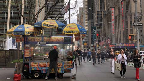 Sabrett Hot Dog Vendor on busy New York City street near Radio City Music Hall. (Photo by: Lindsey Nicholson/UCG/Universal Images Group via Getty Images)