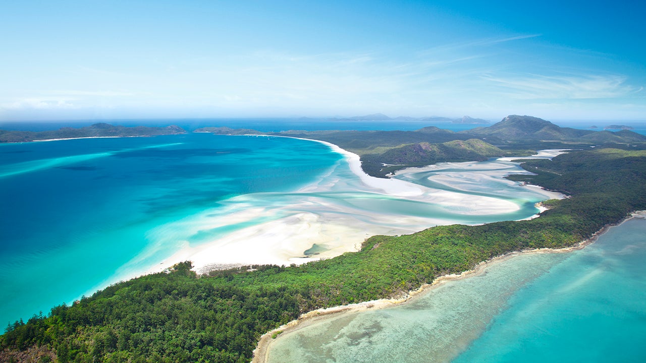 Four-mile long Whitehaven Beach is located on Australia&rsquo;s Whitsunday Island. The area has a strict visitation policy enforced by the Great Barrier Reef Marine Park Authority, keeping it free from crowds and pristine to those who are lucky enough to visit. (Aaron Foster via Getty Images)