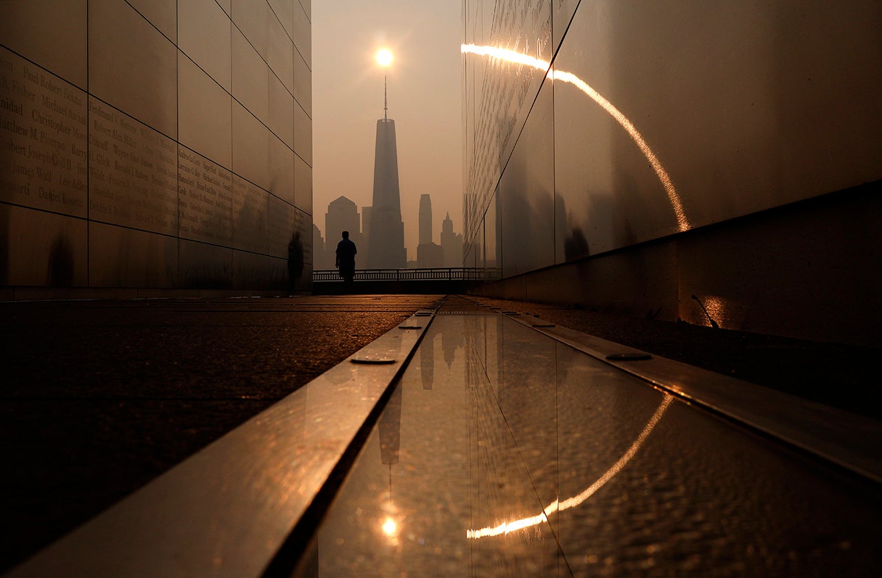 Smoke shrouds the skyline of lower Manhattan and One World Trade Center as the sun rises in New York City on Friday, June 30, 2023, as seen from Jersey City, New Jersey. (Gary Hershorn/Getty Images)