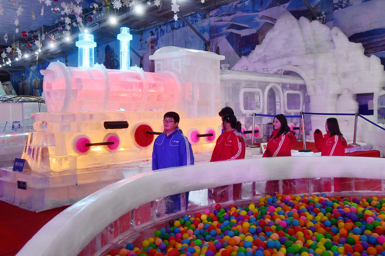 Tourists view a train-shaped ice sculpture at the Ice Sculpture Art Museum in Handan, Hebei Province, China, July 10, 2023. It is reported that the museum covers an area over 53,000 square feet, uses advanced refrigeration technology and houses 600 tons of ice. The temperature inside the building is just 6.8 degrees Fahrenheit. (CFOTO/Future Publishing via Getty Images)