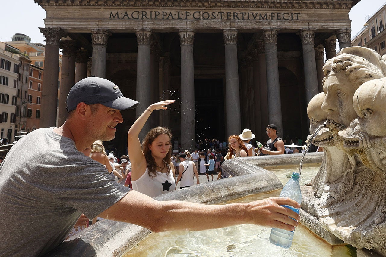A tourist fills a water bottle at a fountain in front of the Pantheon during a sultry day in Rome, Italy, on July 17, 2023. Rome, Bologna and Florence are among the 16 Italian cities for which authorities issued hot weather red alerts on Monday, and that number rose to 20 on Tuesday as temperatures are expected to continue to climb in the coming days. 