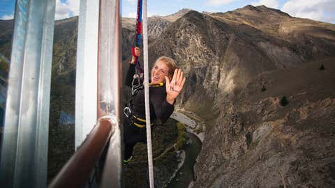 The Nevis bungee is one of the most talked about activities in all of New Zealand. The 134 meter jump from the center of the Nevis Bluff makes most people shake with fear before jumping and then beg for another jump after. A jumper is seen above after getting pulled up after the jump with a note on her hand for her mom. (Matthew Micah Wright via Getty Images)