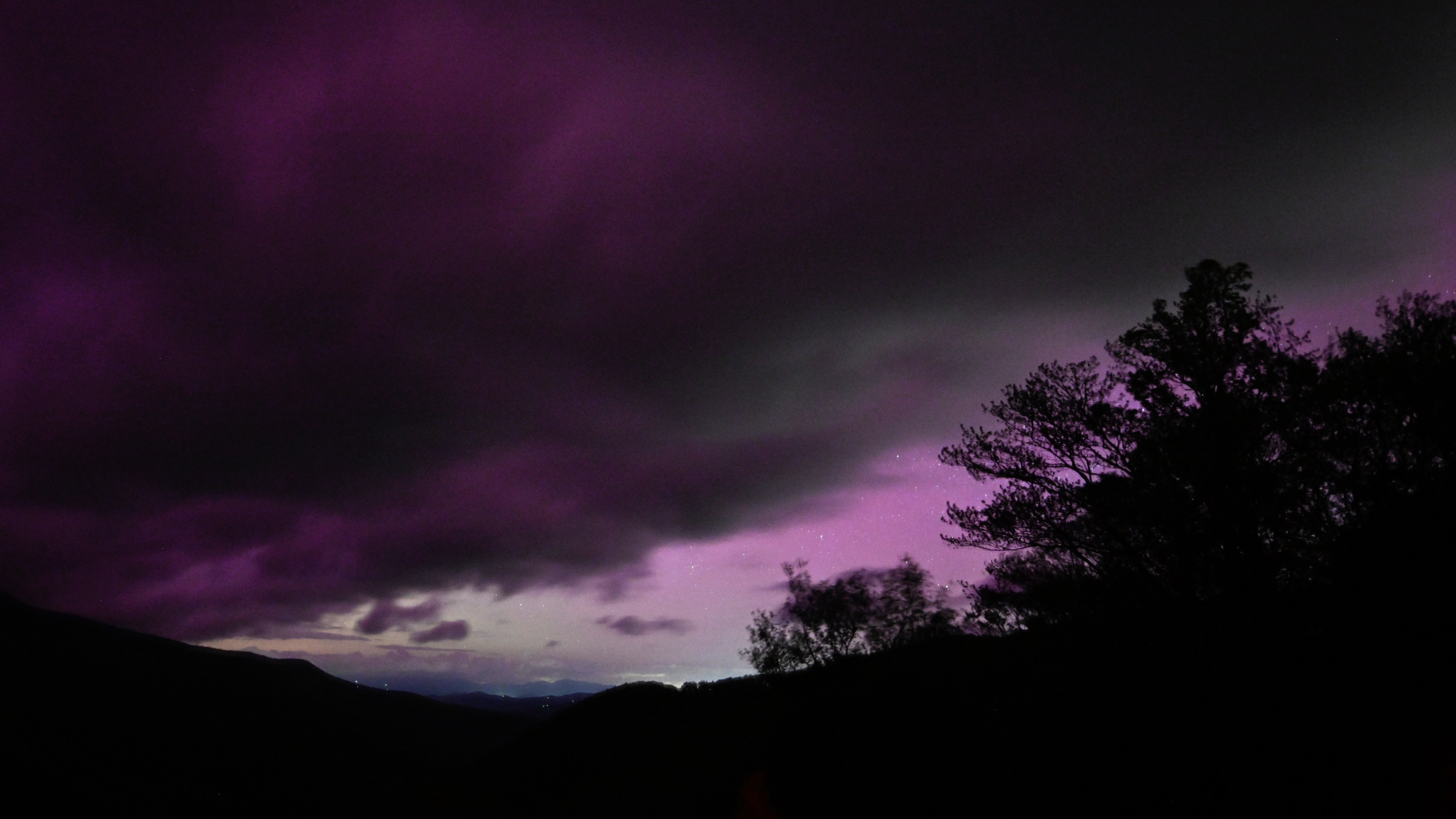 MOUNT MITCHELL, UNITED STATES - MAY 10: Unusual sun activity created a G5 Geostorm on Earth sparks northern lights (Aurora Borealis) in Mount Mitchell, North Carolina, United States on May 10, 2024. (Photo by Peter Zay/Anadolu via Getty Images)