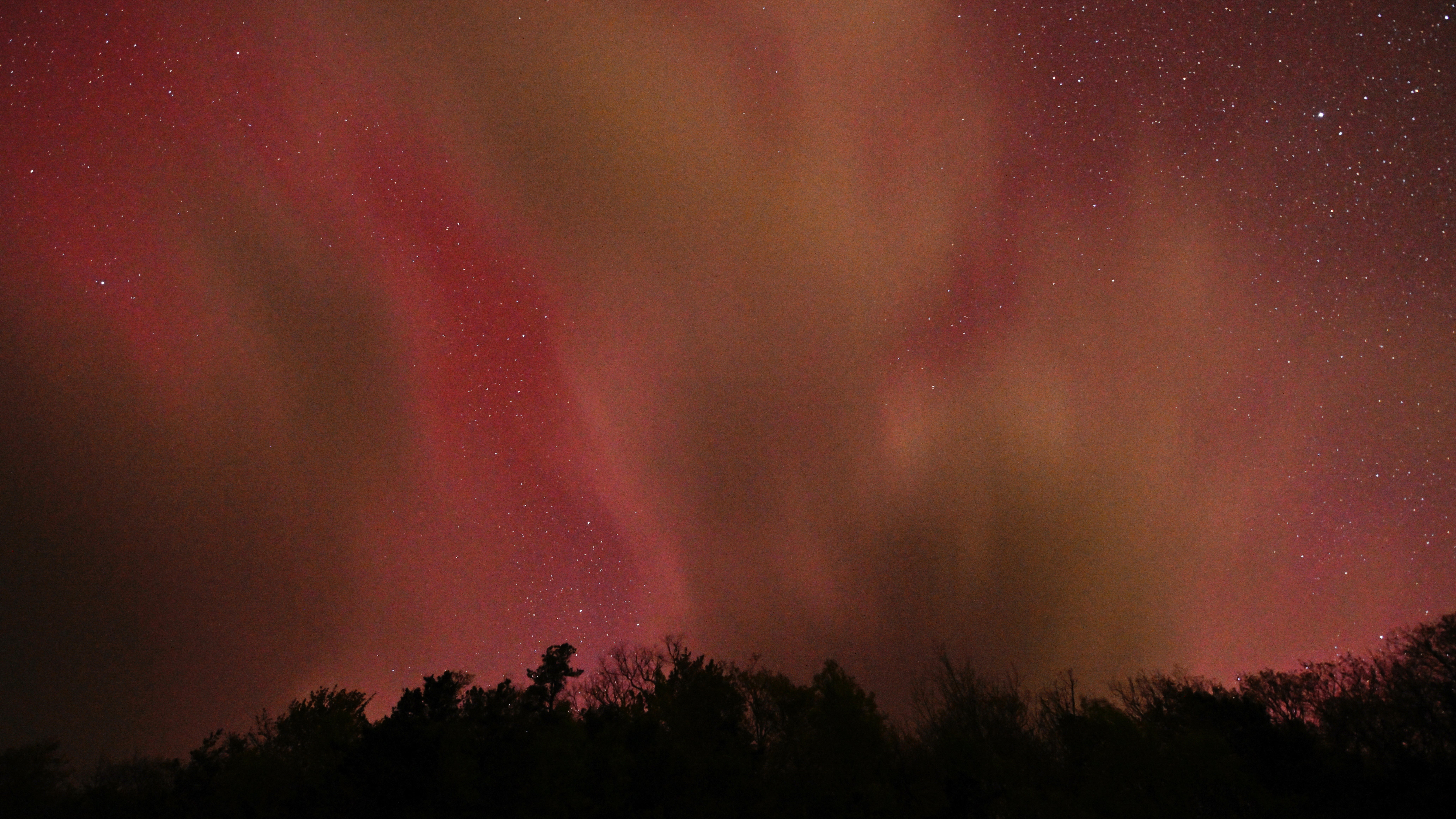 MOUNT MITCHELL, UNITED STATES - MAY 10: Unusual sun activity created a G5 Geostorm on Earth sparks northern lights (Aurora Borealis) in Mount Mitchell, North Carolina, United States on May 10, 2024. (Photo by Peter Zay/Anadolu via Getty Images)