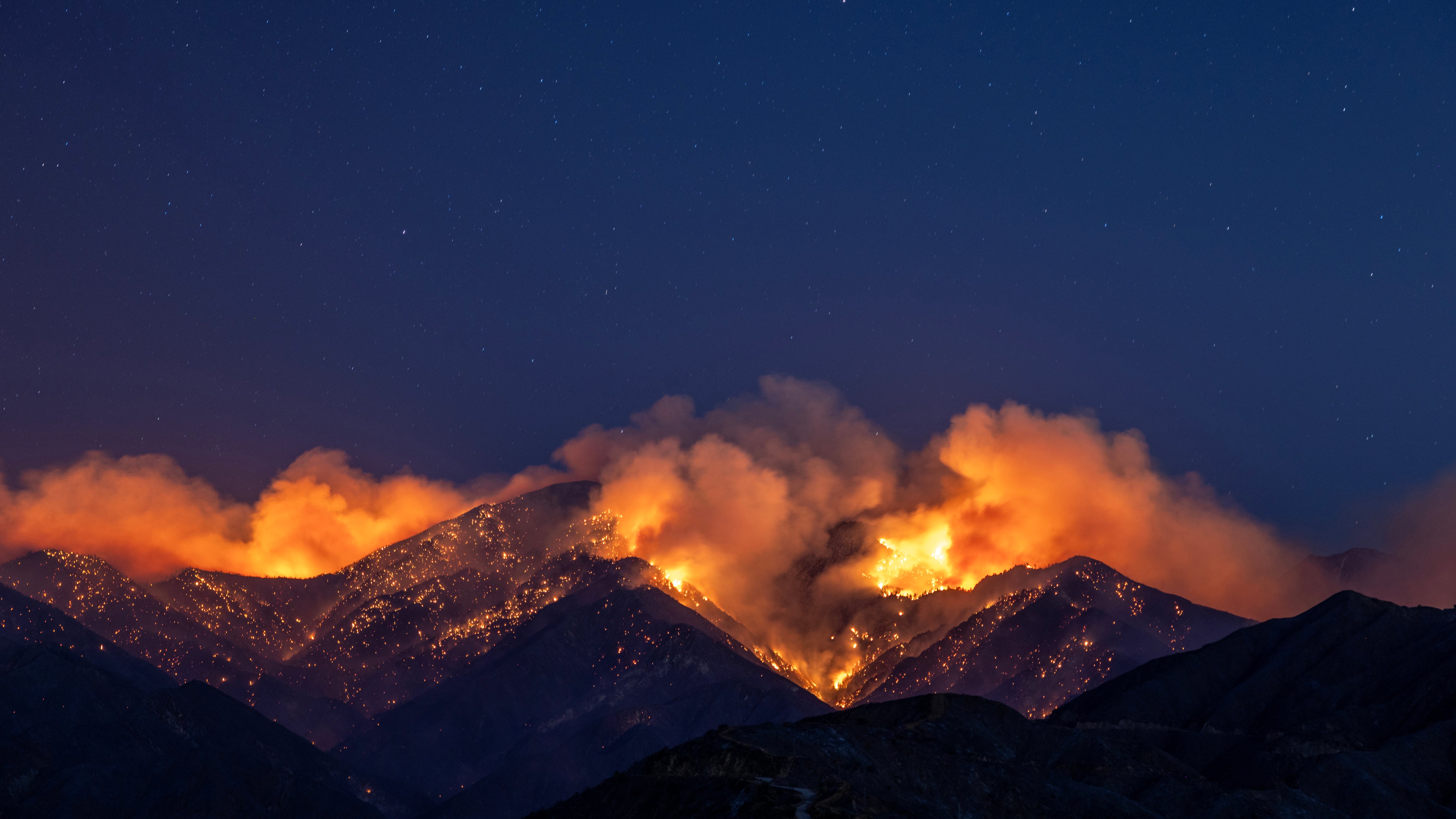 The Bridge Fire is seen as it exploded in size from four square miles to 73 square miles in single day, racing up the San Gabriel Mountains toward the ski resort community of Wrightwood, on Sept. 10 2024, near Glendora, California. (David McNew/Getty Images)