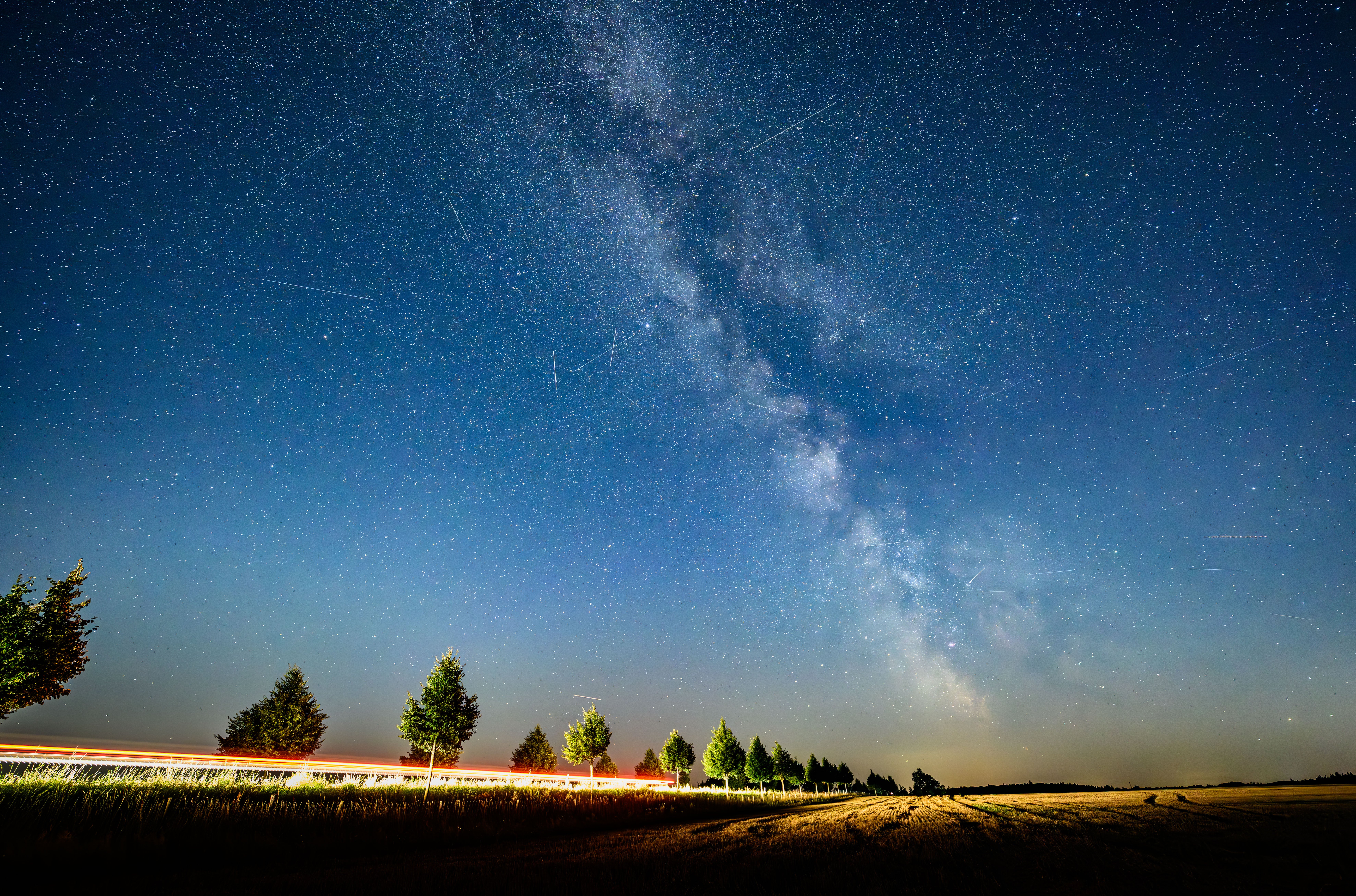 19 August 2025, Brandenburg, Lietzen: Part of the Milky Way can be seen in the starry night sky together with the light trails of passing satellites. Photo: Patrick Pleul/dpa (Photo by Patrick Pleul/picture alliance via Getty Images)
