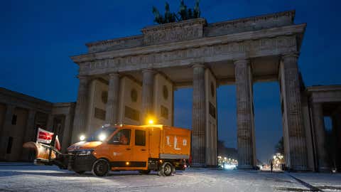 Weather Of The World: November 24 - 30 12 dpatop - 24 November 2025, Berlin: A snow clearing vehicle drives in front of the Brandenburg Gate after a snowfall. Photo: Fabian Sommer/dpa (Photo by Fabian Sommer/Image Combine via Getty Images)
