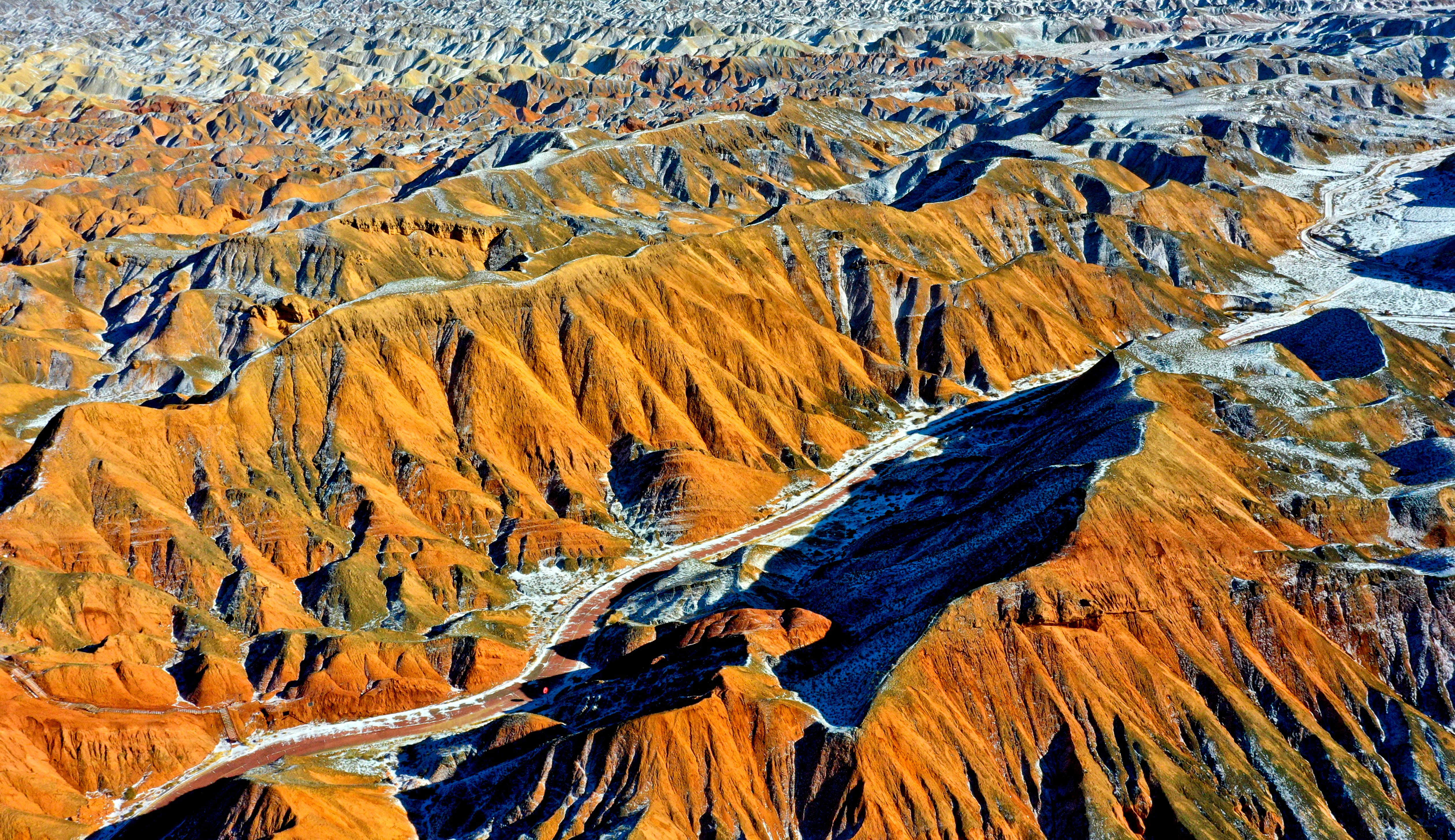 ZHANGYE, CHINA - NOVEMBER 24, 2025 - Danxia Tourist Scenic Area snow scenery in Zhangye City, Gansu Province, China on November 24, 2025. (Photo credit should read CFOTO/Future Publishing via Getty Images)