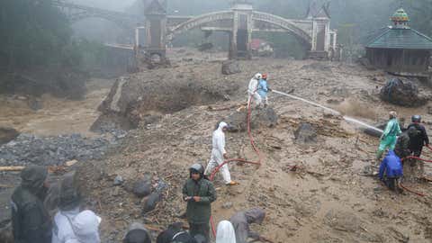 Weather Of The World: November 24 - 30 8 WEST SUMATRA, INDONESIA - NOVEMBER 27: Indonesian rescue workers search for missing people after flash floods in Padang Panjang, West Sumatra province, Indonesia, November 27, 2025. At least 12 people, including children, have been killed and several others are missing after floods and landslides hit several areas in West Sumatra. (Photo by Adi Prima/Anadolu via Getty Images)