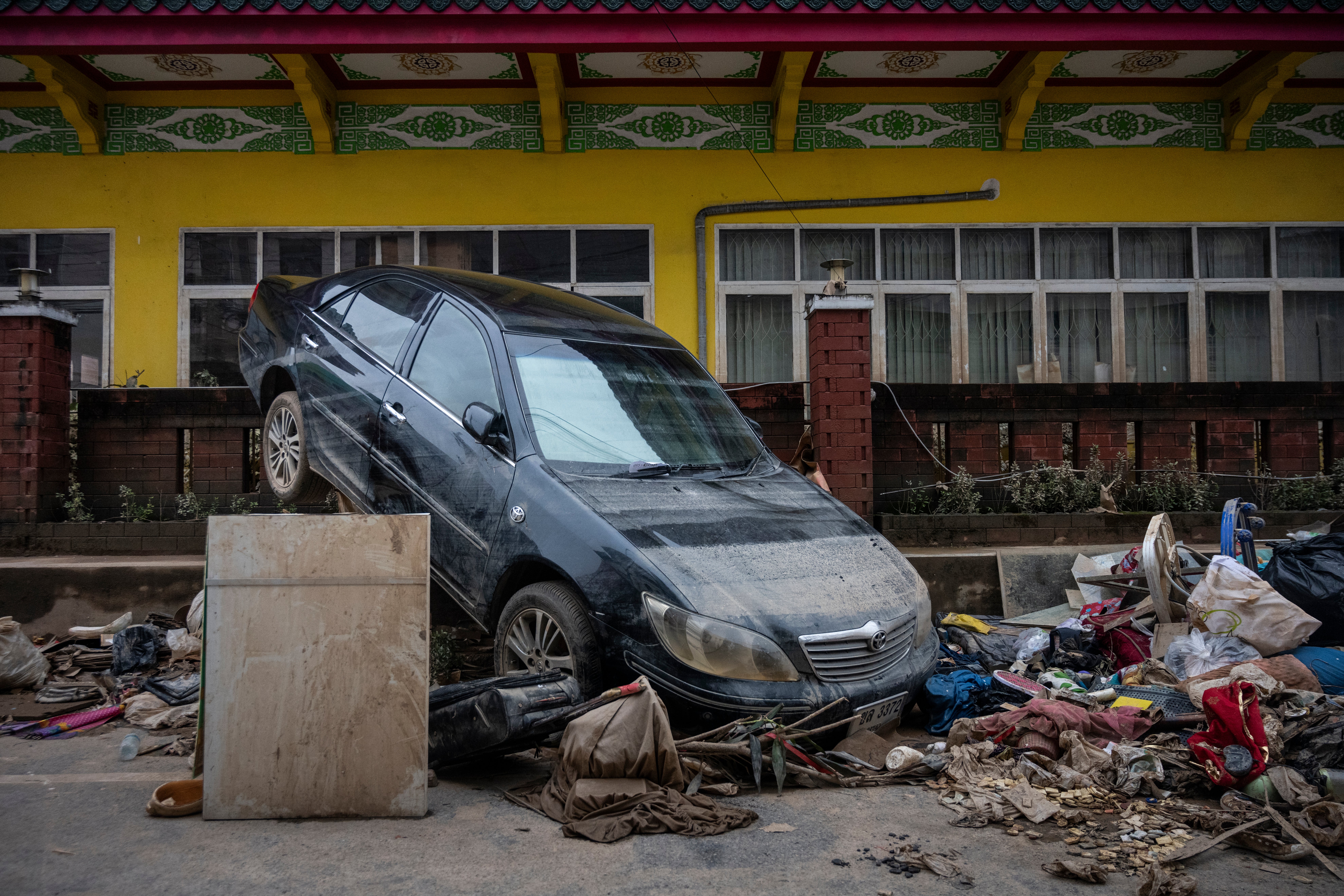 HAT YAI, THAILAND - NOVEMBER 28: A car is seen damaged by the flood in Hat Yai City on November 28, 2025 in Hat Yai, Thailand. Although the official number is still unconfirmed, the death toll of Hat Yai City alone is reportedly in the hundreds during the major floods in Southern Thailand, according to local media. (Photo by Sirachai Arunrugstichai/Getty Images)