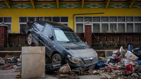 Weather Of The World: November 24 - 30 6 HAT YAI, THAILAND - NOVEMBER 28: A car damaged by floods is seen in Hat Yai town on November 28, 2025 in Hat Yai, Thailand. Although official numbers are still unconfirmed, the death toll in Hat Yai city alone is in the hundreds during the massive floods that hit southern Thailand, according to local media. (Photo by Sirachai Arunrugstichai/Getty Images)