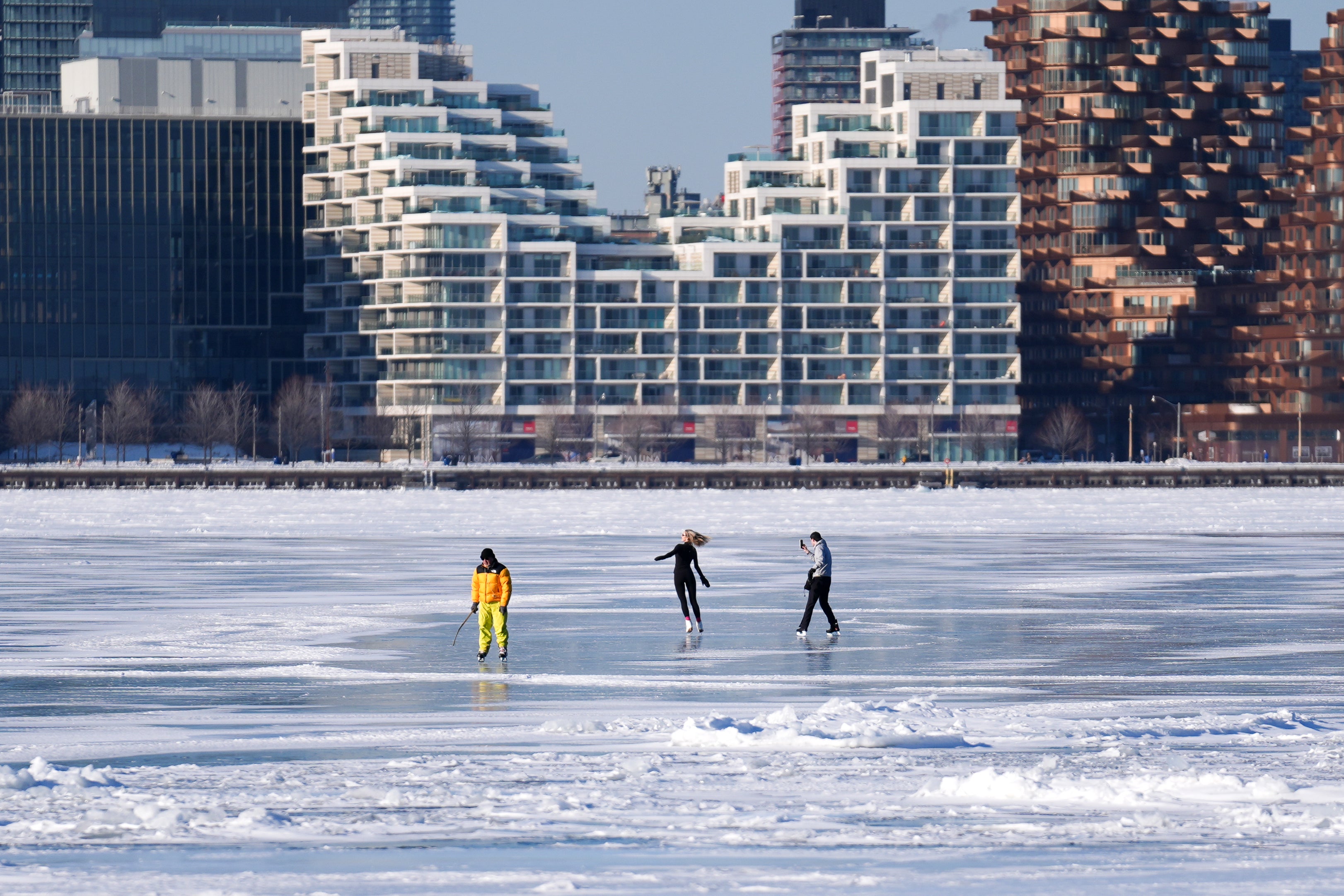 TORONTO, CANADA - FEBRUARY 4 : People ice skate on Lake Ontario&acirc;s frozen surface around the Toronto Island as below-freezing temperatures continue in Toronto, Ontario on February 4, 2026. (Photo by Mert Alper Dervis/Anadolu via Getty Images)