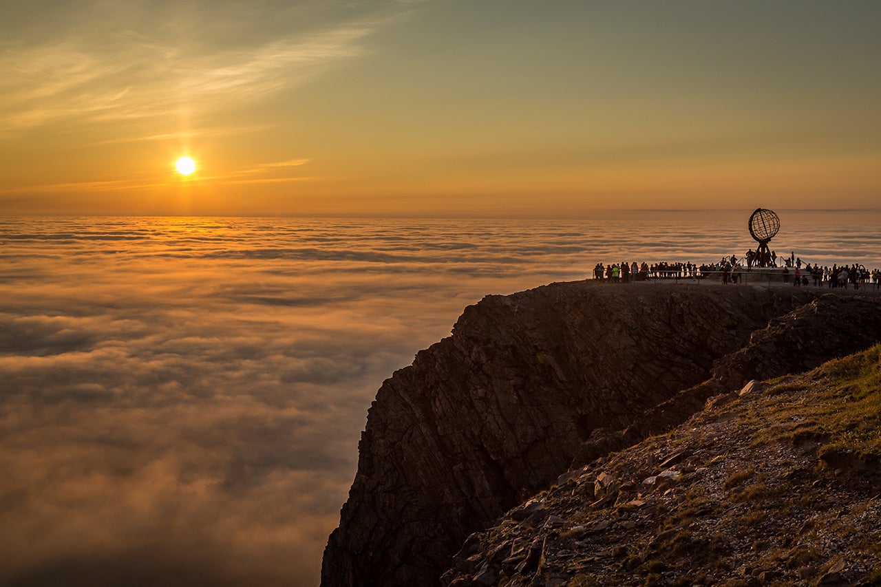Midnight sun in is seen above the clouds in North Cape, Norway. (Getty Images)