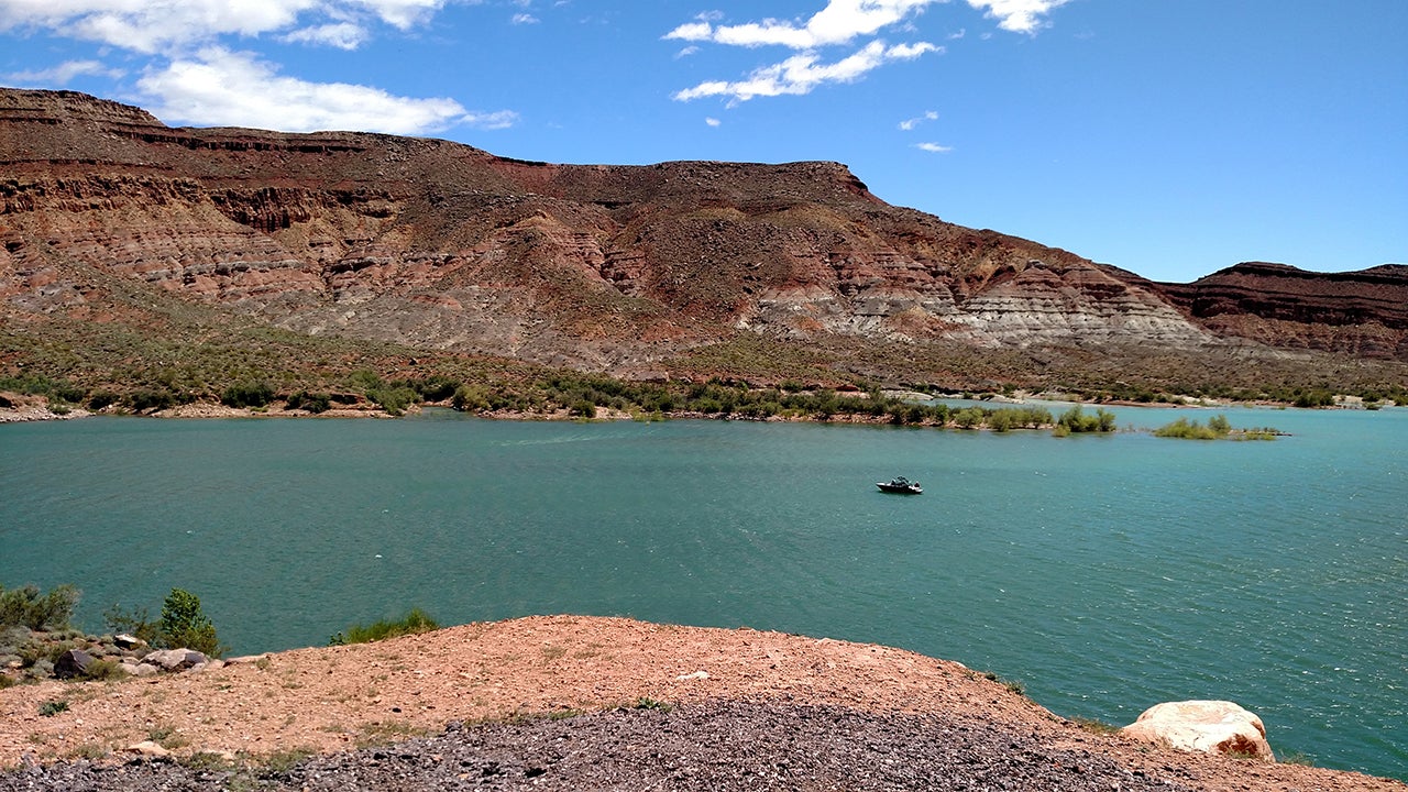 Quail Creek Reservoir is photographed in summertime below red rock outcrops in Hurricane, Utah. (Getty Images)