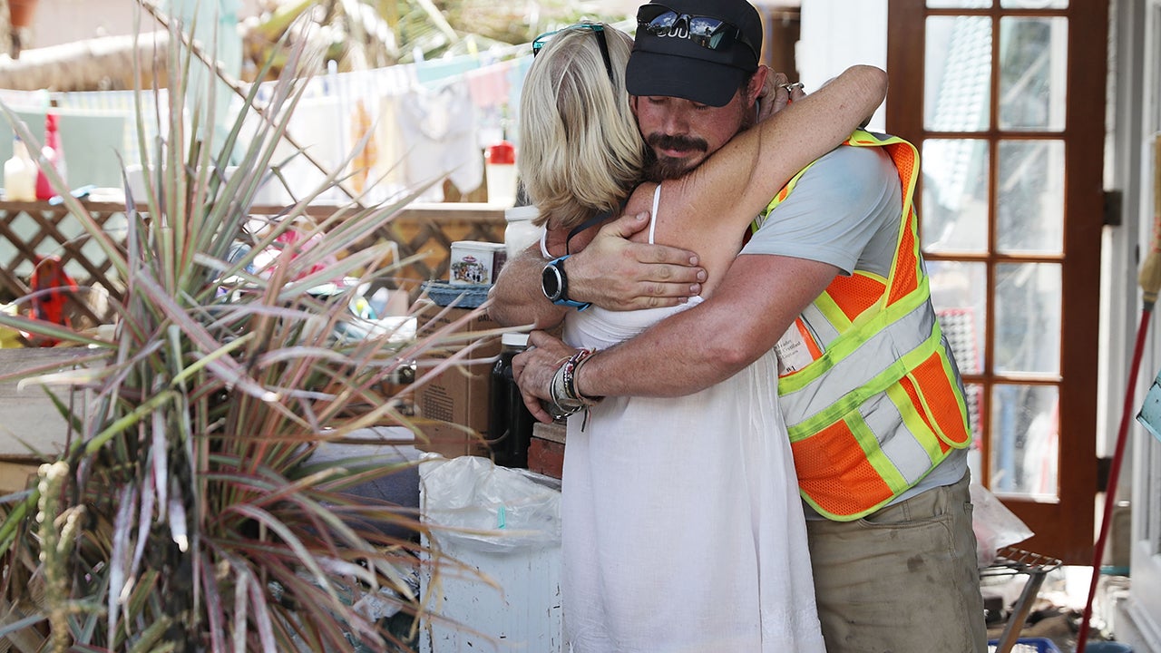 Connie Robertson embraces emergency rescue volunteer Ian Beaumont of Pennsylvania after he delivered some food and water September 15, 2017 in Marathon, Florida. Robertson did not evacuate ahead of Hurricane Irma and floated on her mattress in the 4-foot-high storm surge. "With every hurricane you learn something new," she said. (Photo by Chip Somodevilla/Getty Images)