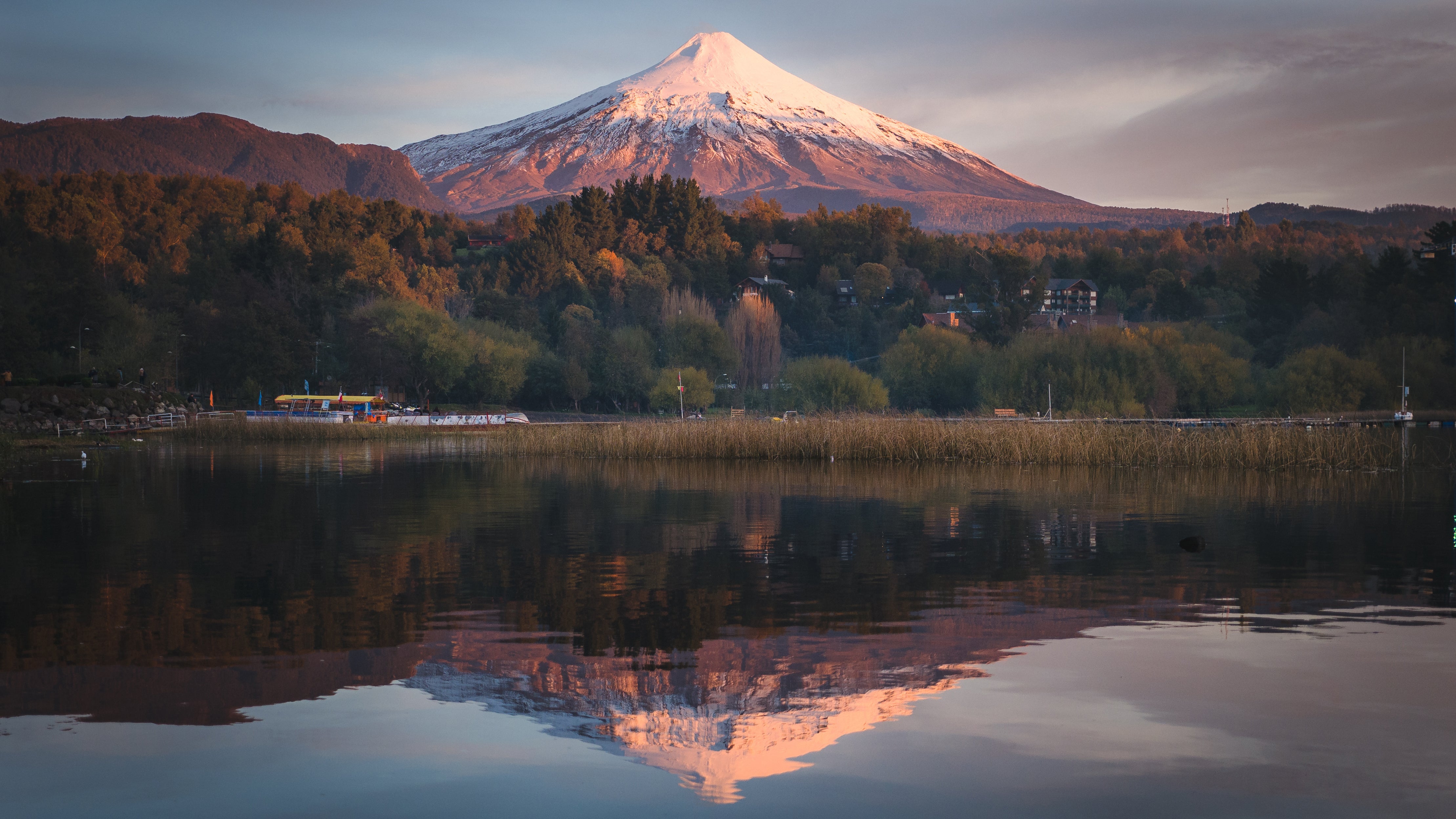 Villarrica Volcano is reflected in the lake below at sunset in Pucon, Chile. (Pakawat Thongcharoen/Getty Images)