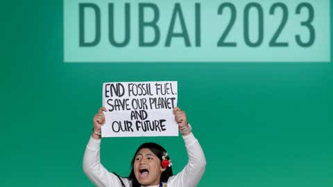 Protester onstage at the Global Climate Action High-Level Event (COP28/Anthony Fleyhan)