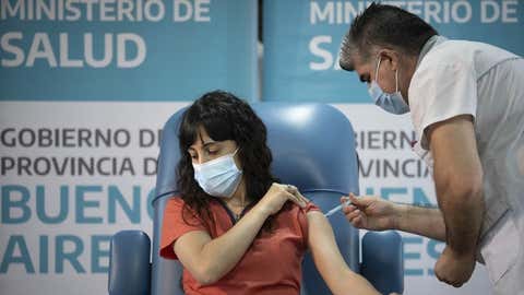 Doctor Estefania Zeurnja receives a dose of a COVID-19 vaccine at the Dr. Pedro Fiorito Hospital in Avellaneda, Argentina, on December 29, 2020. (Xinhua/Martin Zabala/IANS)