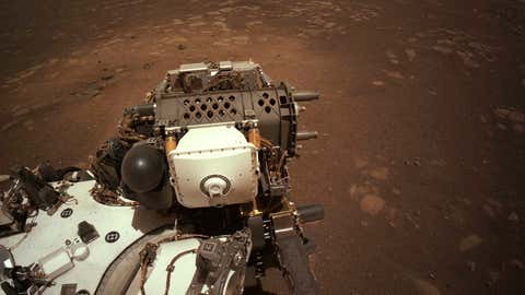 This set of pictures shows the parts. of the robotic arm on NASA's Perseverance rover that bends and turns during its first payout after it landed on Mars. (NASA/JPL-Caltech)