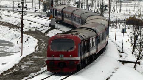 A train crosses a snow-covered railway line at Narbal near Srinagar. (TOI, Delhi, BCCL/Bilal Bahadur)