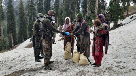 File photo: Army personnel rescue the nomadic Bakarwal tribe of Jammu and Kashmir (IANS)