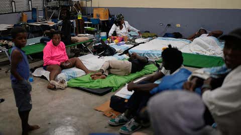 People take shelter in a school ahead of Hurricane Melissa's forecast arrival in Old Harbour, Jamaica, Monday, Oct. 27, 2025. (AP Photo/Matias Delacroix)