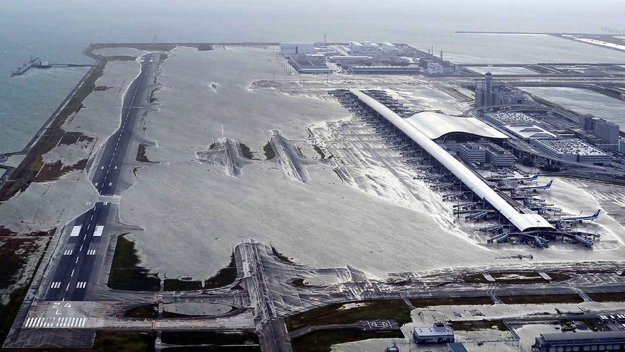Kansai International Airport is partly inundated following a powerful typhoon in Izumisano, Osaka prefecture, western Japan, Tuesday, Sept. 4, 2018. A powerful typhoon blew through western Japan on Tuesday, causing heavy rain to flood the region's main offshore international airport and high winds to blow a tanker into a connecting bridge, disrupting land and air travel. (Kentaro Ikushima/Mainichi Newspaper via AP)