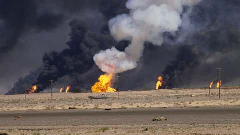 Kuwaiti oil fields burn after retreating Iraqi forces set them on fire on the border of Kuwait and Saudi Arabia, March 4, 1991.