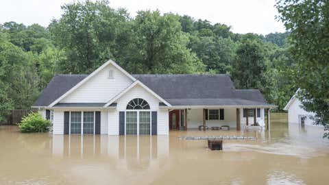A house half submerged by floodwaters from the North Fork Kentucky River in Jackson, Ky., on July 28, 2022. (Leandro Lozada/AFP via Getty Images)