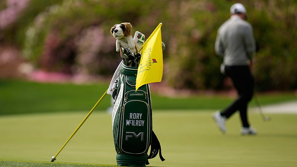 The golf bag of Rory McIlroy, of Northern Ireland, sits near the 13th hole as he putts during a practice round ahead of the Masters golf tournament at the Augusta National Golf Club, Tuesday, April 7, 2026, in Augusta, Ga. (AP Photo/Eric Gay)