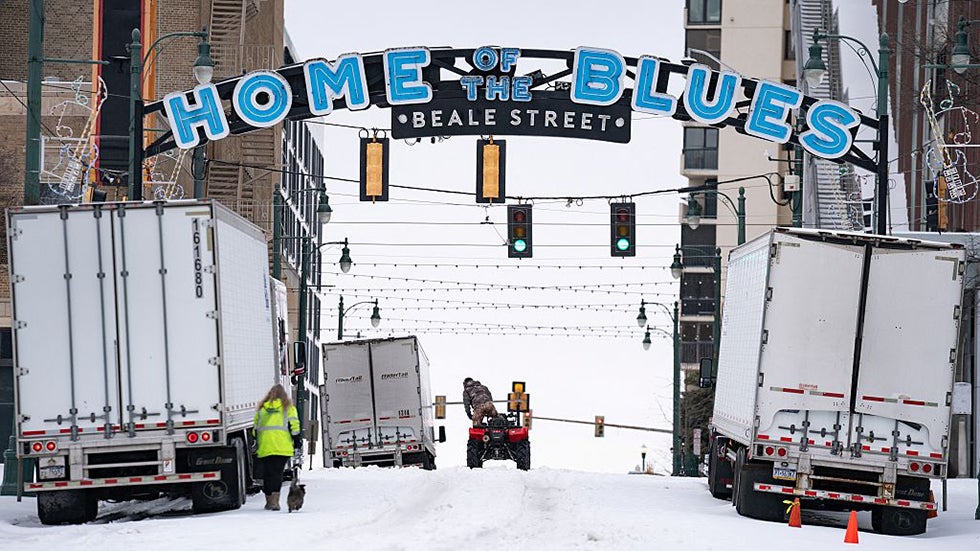 Snow covers Beale Street, known as the "Home of the Blues," in downtown Memphis, Tennessee, on January 25, 2026. A massive winter storm headed towards the northeast United States after sweeping across much of the country, threatening tens of millions of Americans with blackouts, transportation chaos and bone-chilling cold. After battering the country's southwest and central areas, the storm system began to hit the heavily populated mid-Atlantic and northeastern states with snow and freezing rain as a frigid air mass settled in across the nation. (Photo by Kevin Wurm / AFP via Getty Images)