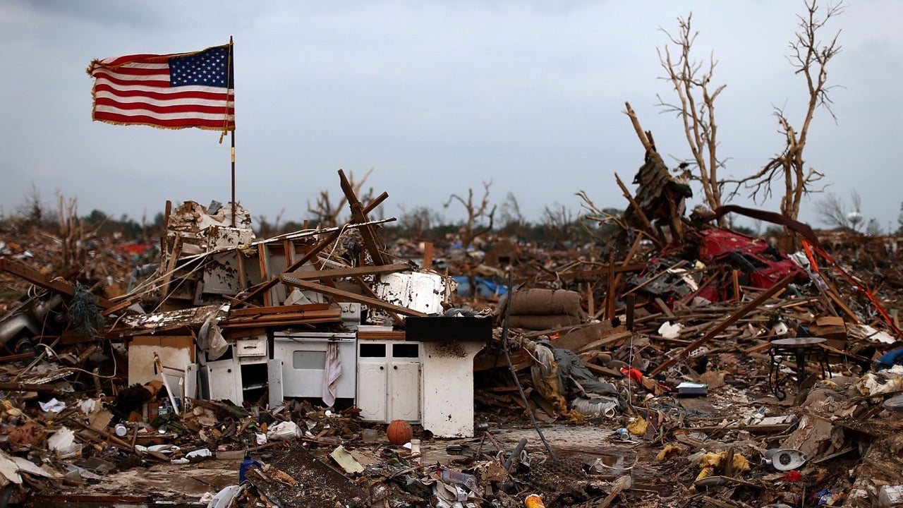 <<enter caption here>> on May 24, 2013 in Moore, Oklahoma. The tornado of at least EF4 strength and two miles wide touched down May 20 killing at least 24 people and leaving behind extensive damage to homes and businesses. U.S. President Barack Obama promised federal aid to supplement state and local recovery efforts.