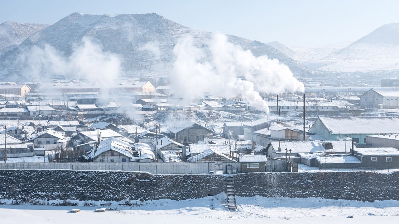 Steam rises over Hyesan, North Korea, seen from Changbai, China. (Elijah Hurwitz)