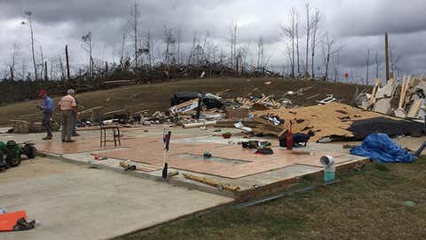 A damage survey team inspects homes destroyed in the Dec. 23,2015 tornadoes in northern Mississippi.