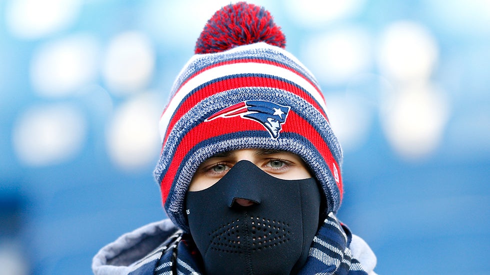 FOXBORO, MA - JANUARY 10: A New England Patriots fan looks on in the cold before the 2014 AFC Divisional Playoffs game against the Baltimore Ravens at Gillette Stadium on January 10, 2015 in Foxboro, Massachusetts.  (Photo by Jim Rogash/Getty Images)