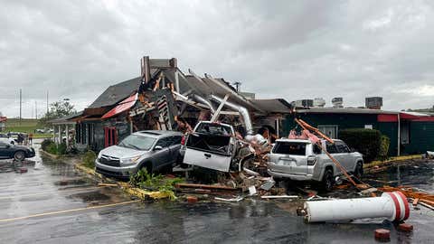 In this photo provided by the City of Rocky Mount, cars are piled along the side of Hing Ta Restaurant after a tornado hit Rocky Mount, N.C., on Friday, Sept. 27, 2024.