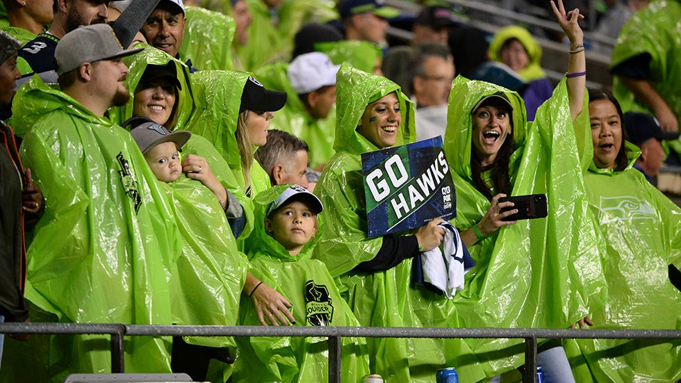 SEATTLE, WA - AUGUST 29: Seattle fans don't let a little rain dampen their spirits during a preseason game between the Oakland Raiders and the Seattle Seahawks on August 29, 2019 at Century Link Stadium in Seattle, WA (Photo by Jeff Halstead/Icon Sportswire via Getty Images)