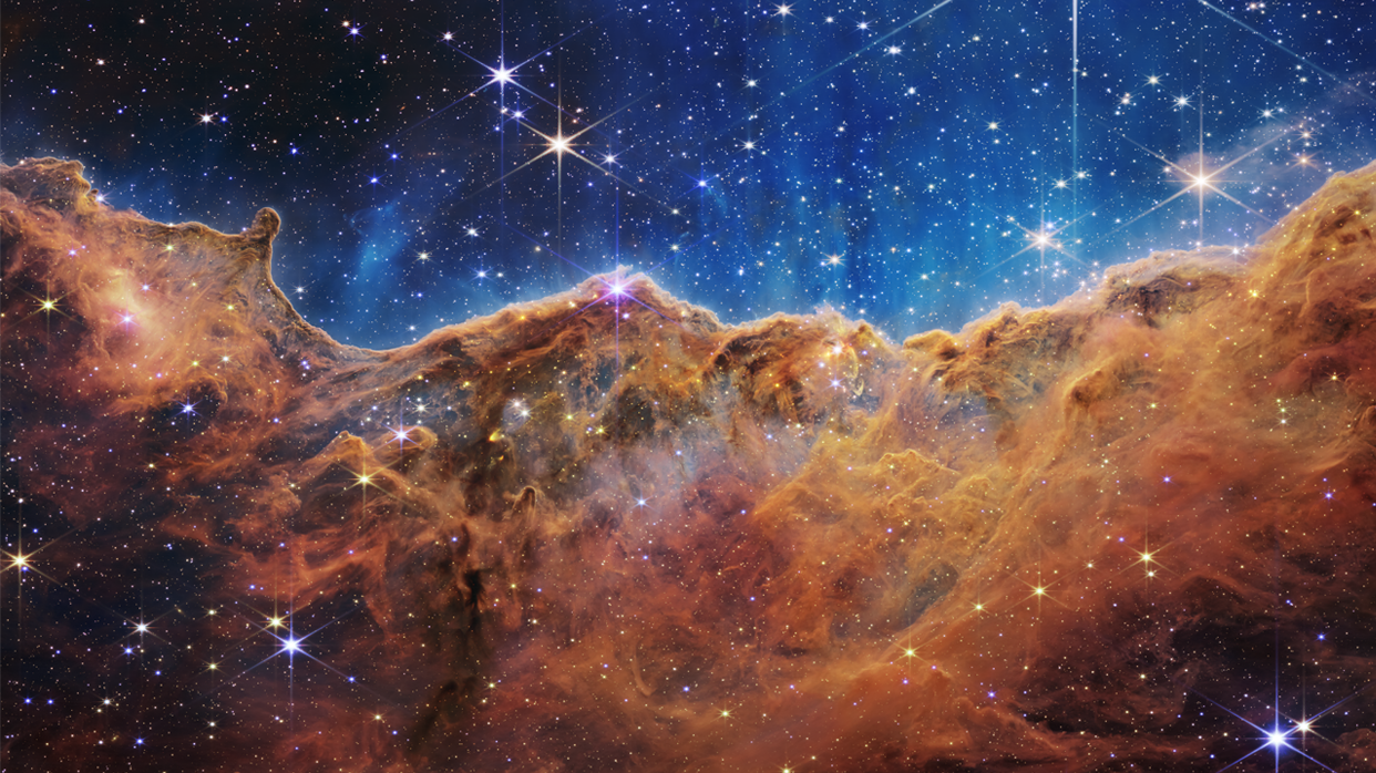 This photo was one of the first photos taken by the James Webb Telescope in 2022. The image depicts a mountain-like star-forming region called NGC 3324 in the Carina Nebula. (James Webb Space Telescope/NASA)