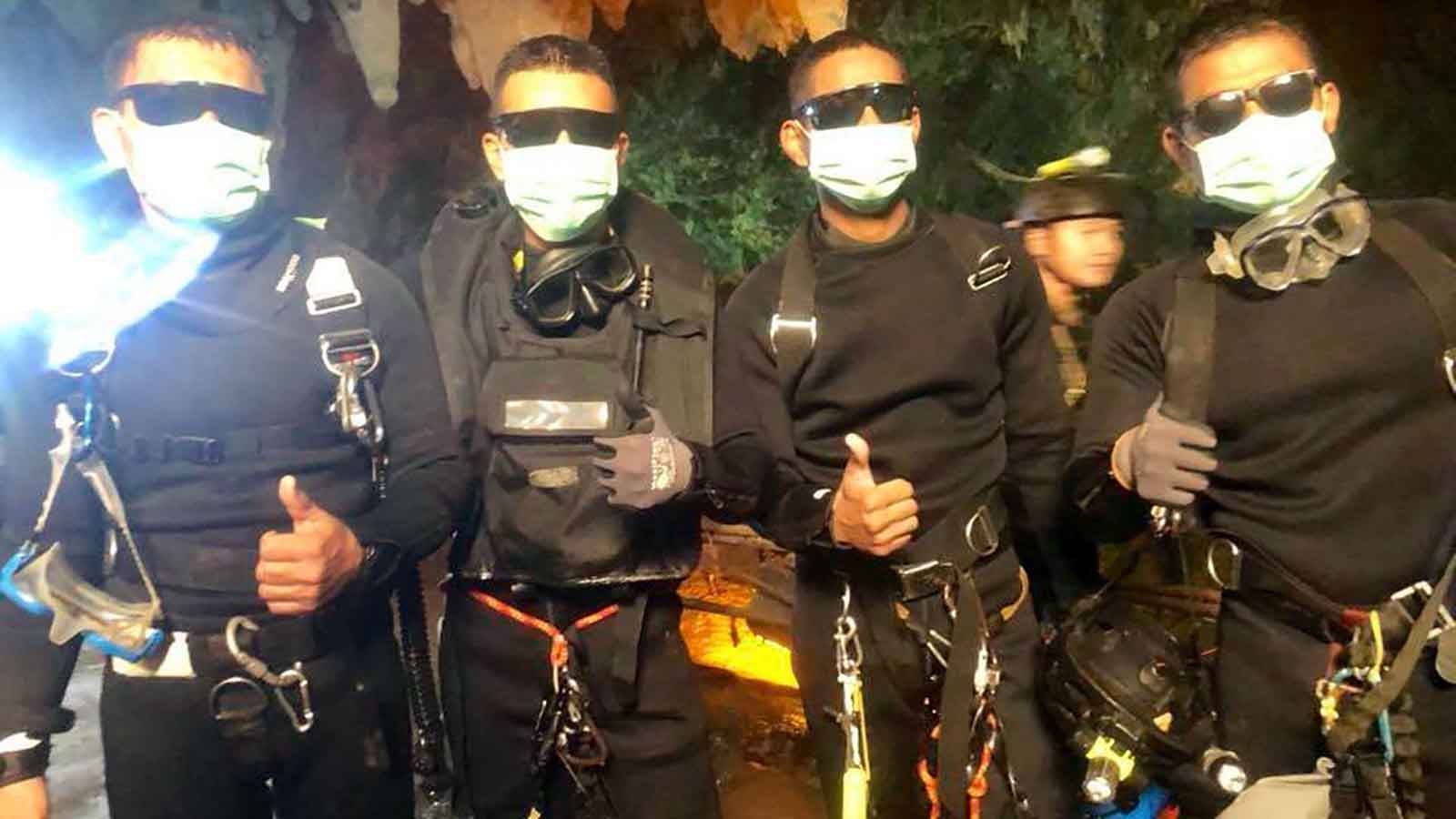 In this undated photo released by Royal Thai Navy on Tuesday, July 10, 2018 show the last four Thai Navy SEALs come out safely after completing the rescued mission inside a cave where 12 boys and their soccer coach have been trapped since June 23, in Mae Sai, Chiang Rai province, northern Thailand. Thailand's navy SEALs say all 12 boys and their soccer coach have been rescued from a flooded cave in far northern Thailand, ending an ordeal that lasted more than two weeks. (Royal Thai Navy via AP)