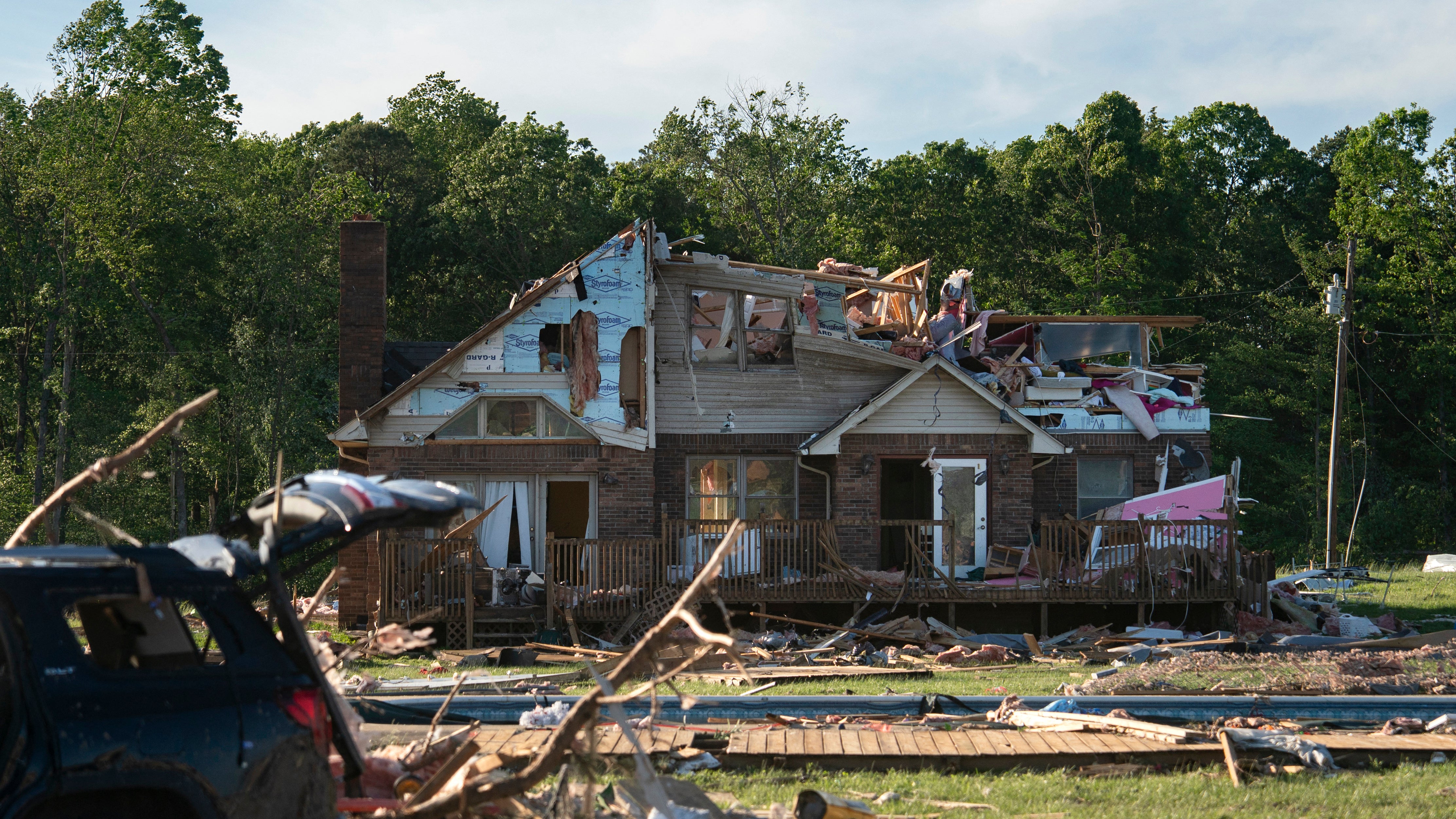 A damaged house is seen after a tornado hit in London, Kentucky on May 17, 2025. Severe storms that swept through the US states of Missouri, Kentucky and Virginia left more than 25 people dead, laying waste to local communities and cutting off electricity to nearly 200,000, authorities said on May 17. Kentucky Governor Andy Beshear said on X at least 18 people had died in the storms Friday night, while local officials in Missouri said another seven were dead there. (Photo by Allison Joyce / AFP) (Photo by ALLISON JOYCE/AFP via Getty Images)          