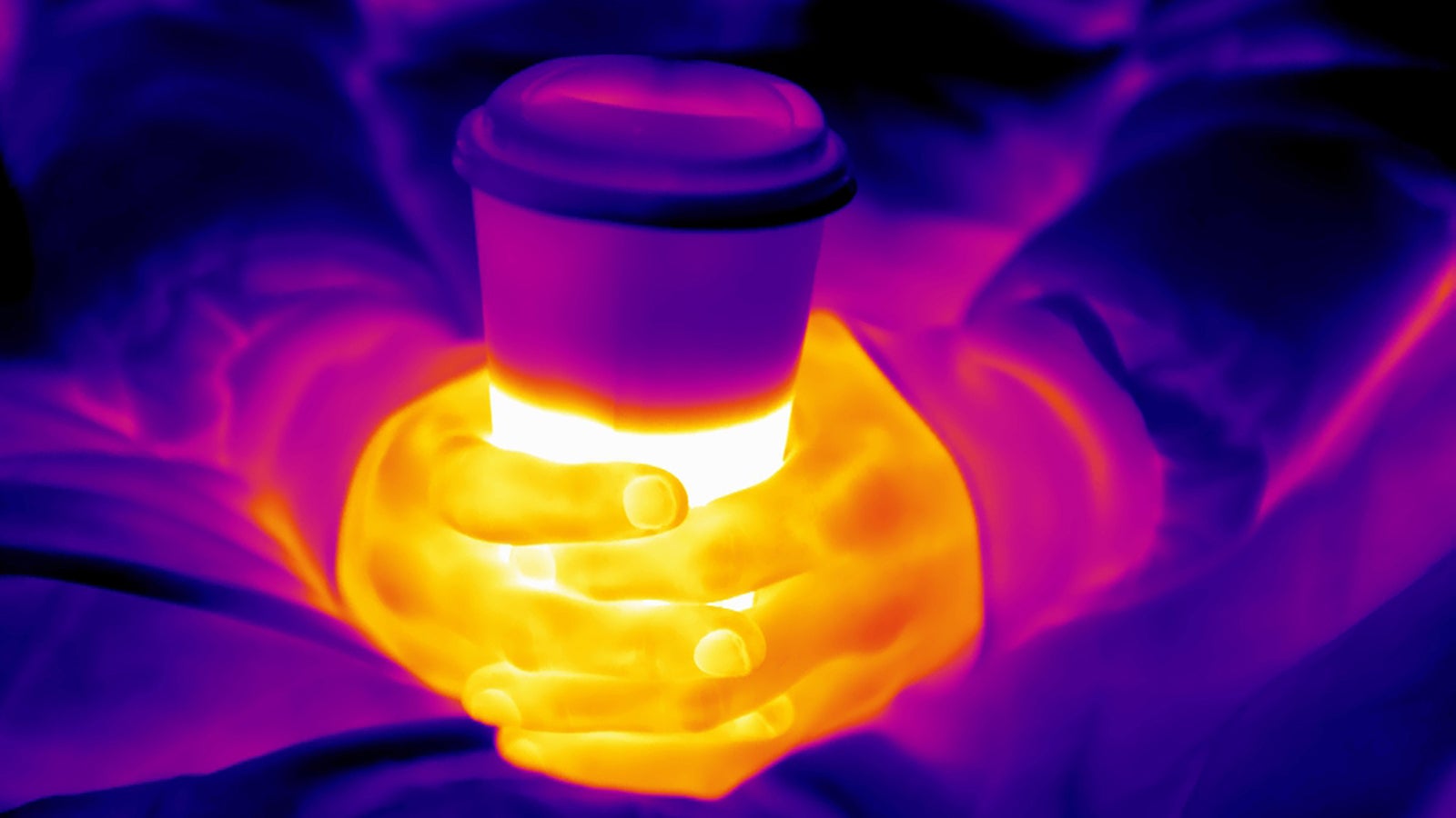 Michael, 33, holds a cup of warm tea that someone bought for him. He sleeps under the cover of London's Apollo Victoria Theatre when he can. The carpets outside the front doors prevent his body getting too cold from underneath which can be deadly. He is trying to save up enough money to put a month&rsquo;s rent deposit down on a flat. (Grey Hutton)